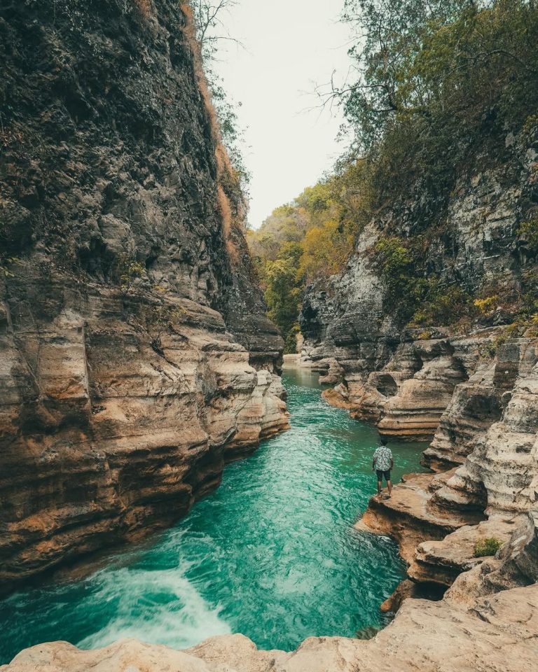 Tangedu Waterfall Sumba with turquoise river and limestone canyon